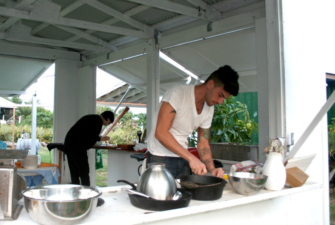 A hip, tattooed chef prepares a six course meal in an open-air farmstand at ARTfarm.