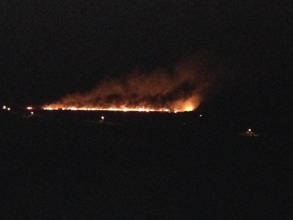 Another shot of the fire as it continued to spread and head south. Our truck is the tiny pinpoint of light close to the west end (right) of the fire line. Above us and closer to the fire is a VIFD truck.