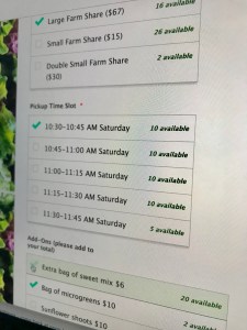 A computer screen shows the sign-up form for ARTfarm’s box shares